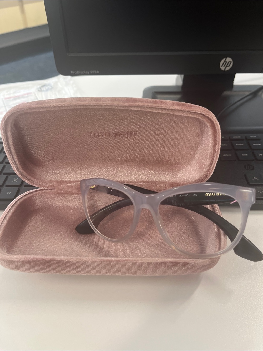 Miu Miu Translucent Lilac Cat-Eye Glasses with Black Temples
